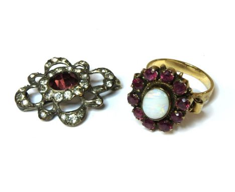 An opal and ruby cluster ring, tested as approximately 9ct (high zinc content), together with a silver paste stone brooch