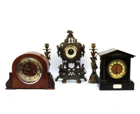A Victorian slate mantel clock, bronzed pilaster supports, and plaque inscribed to Rev G and Mrs Thompson, St Luke's Baldwin 