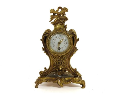 An ormolu mantle clock, with a painted enamel dial, with floral swags, 23.5cm