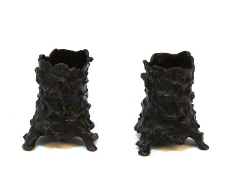 A pair of cast metal spill vase mounts, cast with lizards and snakes amongst a tree trunk, 8cm high (2)