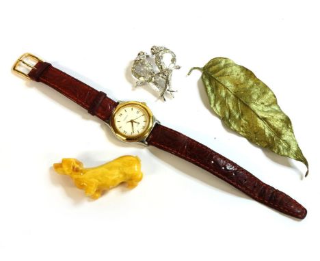 A ladies bi-colour Tissot prx quartz strap watch, a leaf brooch, and a paste stone brooch of love birds, and an amber coloure