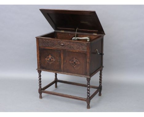 A Fullotone cabinet gramophone,  one case, on turned legs, united by stretchers