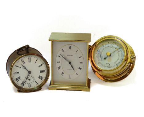 A circular brass clock, together with a mantle clock by Garrard, and a brass barometer