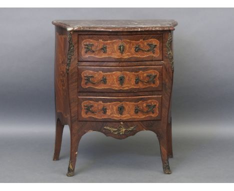 A late 19th century early 20th century French, Kingwood bombe commode, the marble inset top over three drawers, all with gilt