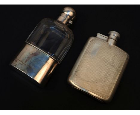 Two silver flasks: one with engine turned decoration, by John Dixon & Son, Sheffield, 1964, the other with cut glass body, Bi