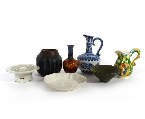 A Chinese blue and white ewer with flowers, another ewer with dragons imitating Sancai glaze, a vase imitating jun glaze, a j