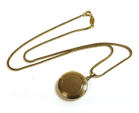 A 9ct gold circular engine turned decorated locket, with foxtail chain marked 750, by Uno A.Erre,locket 3.44gchain 5.56g