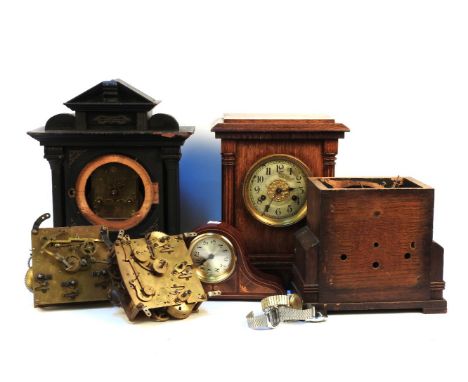An early 20th century oak cased mantel clock, with gong strike movement, together with a collection of clock parts
