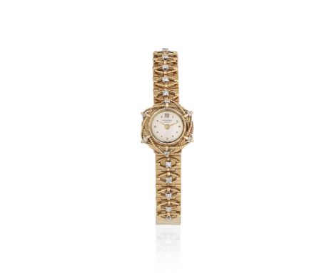 Universal Genève. A lady's 18K gold and diamond set manual wind bracelet watchDate: Circa 1950Movement: Jewelled Cal.244N man