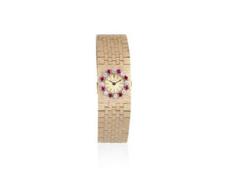 Bueche-Girod. A 9K gold ruby and diamond set manual wind bracelet watchDate: Circa 1980Movement: 17-jewel manual windDial: Ch