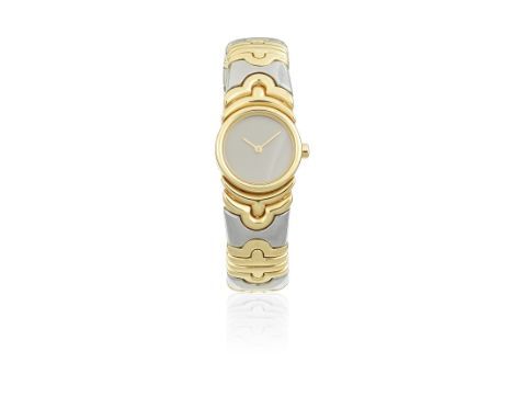 Bulgari. A lady's 18K gold and stainless steel quartz bracelet watchModel: ParentesiReference: BJ01Date: Purchased 2nd June 1