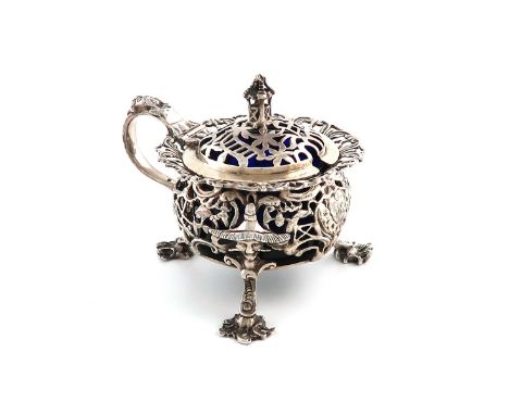 A Victorian silver Chinoiserie mustard pot, by John Figg, London 1841, circular pierced form, with foliate scroll decoration,