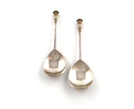 A pair of Elizabeth I silver seal-top spoons, maker's mark of W within a sun, London 1561, fig-shaped bowl, faceted tapering 