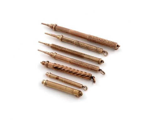 A collection of seven gilt-metal propelling pencils, one double extension, the others single extension, cylindrical and hexag
