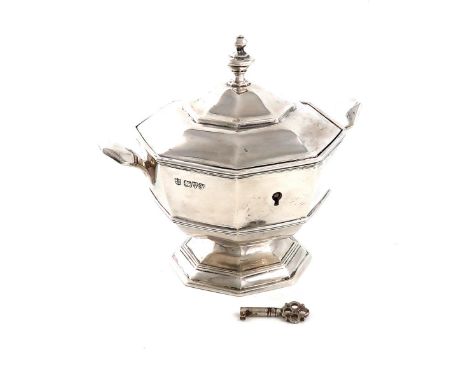 An Edwardian silver caddy, by Nathan and Hayes, Chester 1908, octagonal baluster form, with side handles, raised cover with a