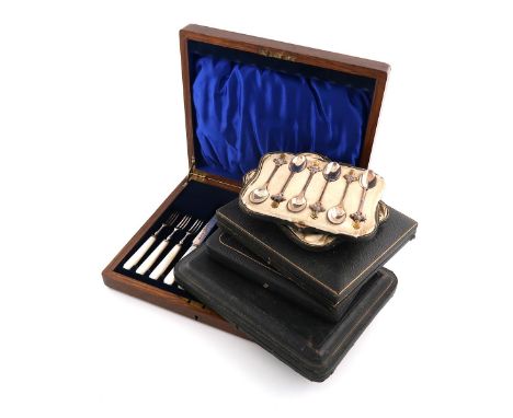 A collection of five cased sets of silver flatware, comprising: a set of six Edwardian fruit knives and forks, carved mother-