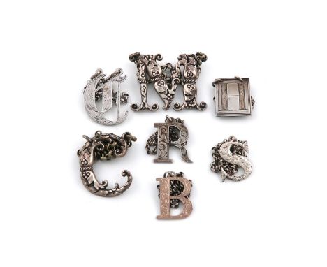A collection of antique silver 'Cut-out' letter wine labels, various dates and makers, comprising: two by George Unite 'R' an