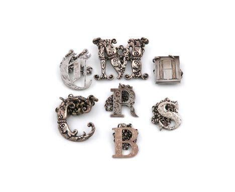 A collection of antique silver 'Cut-out' letter wine labels, various dates and makers, comprising: two by George Unite 'R' an