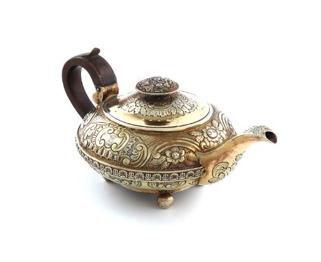 A George III presentation silver-gilt bachelor's teapot, by John Page, London 1816, compressed circular form, chased foliate 