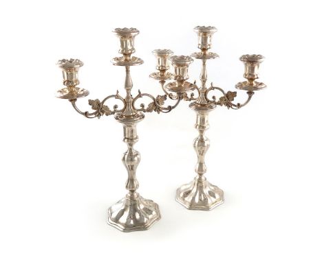 A pair of modern Irish silver three-light candelabra, by Royal Irish, Dublin 1973, lobed baluster stems, foliate scroll branc