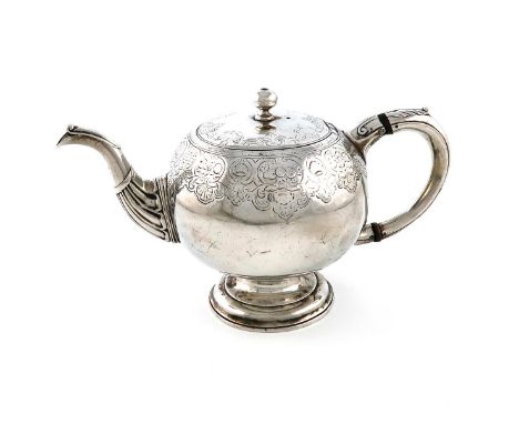 A George II Scottish silver teapot, by John Main, assay master Archibald Ure, Edinburgh probably 1736, bullet form, leaf capp