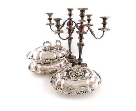 A set of three Victorian electroplated entree dishes and covers, shaped oblong form, foliate scroll borders and detachable ha