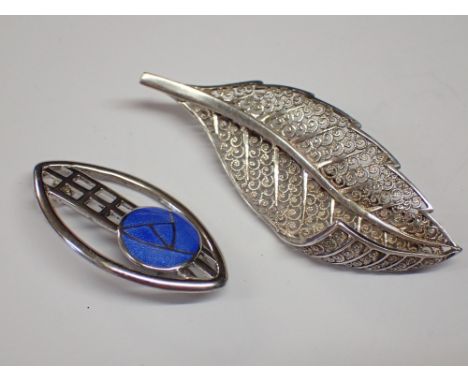 Two silver brooches including an enamel example
