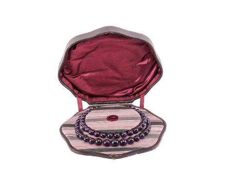 A double-row amethyst bead choker necklace with a pearl cluster clasp, comprising two strands of graduated round amethyst bea