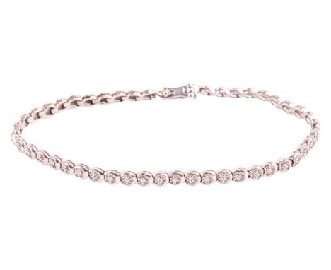 A 9ct white gold diamond-set tennis bracelet; comprised of interlocking semi-round links, alternately set with round-cut diam