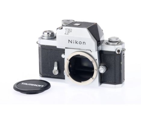 A Nikon F Photomic 35mm SLR Camera Body, chrome, body G, shutter working, metered prism untested, with Tamron branded body ca