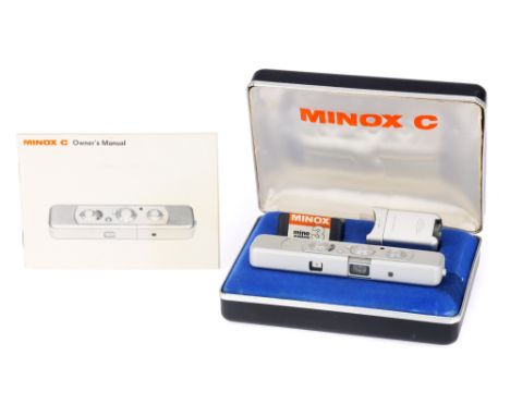 A Minox C Sub-Miniature Camera, chrome, body G, shutter untested, together with a flash attachment &amp; a single roll of sea