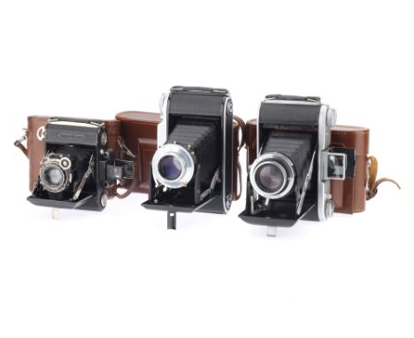 Three Voigtlander Ensign and Zeiss Ikon Folding Cameras comprising a VoigtlÃ¤nder Bessa I 6 x 9cm camera with a Color-Skopar 