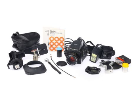 A Mamiya 645 Medium Format SLR Camera, black, body G, shutter working when batteries are inserted, together with a Mamiya-Sek