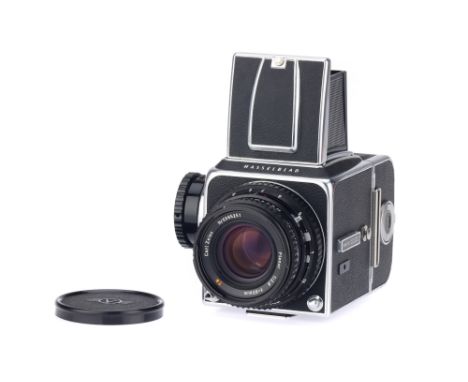 A Hasselblad 500c/m Medium Format SLR Camera, chrome, serial no. RS 1237250, c.1980, body G-VG, together with a Carl Zeiss Pl