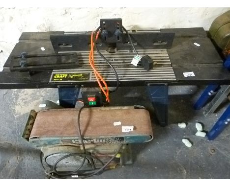 A router table and Clarke belt/disc sander