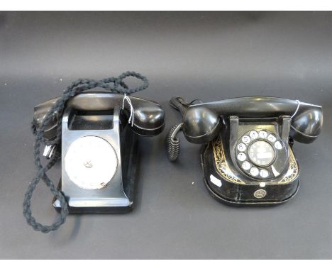 A vintage black bakelite telephone and Bell telephone 