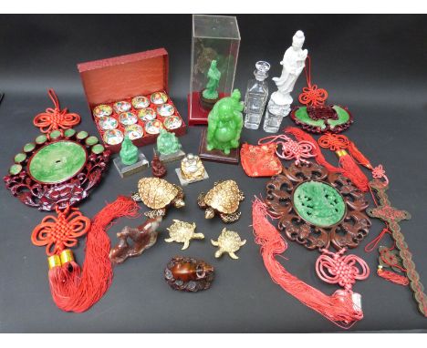 A quantity of Oriental buddha figures, carved horses, jade style plaques, turtles etc