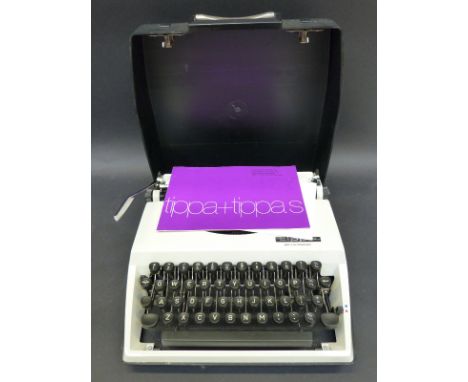 A Frister Rossmann portable sewing machine together with an angle poise hobby magnifier lamp and a "Tippa" portable typewrite