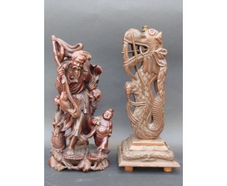 A Chinese carved wooden figure group featuring a fisherman and young boy, 35cm tall together with a similar carved lamp base 