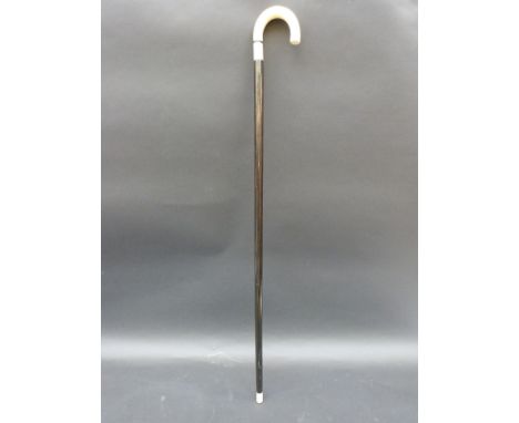 An ebony and ivory walking stick, 86cm long