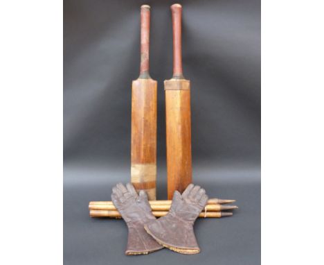 Two vintage cricket bats, stumps and a pair of gloves