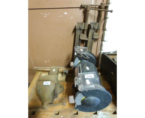 A bench grinder, vice and three sash clamps