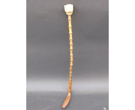 A 19thC / 20thC riding crop with carved ivory bulldog head finial, 58cm long