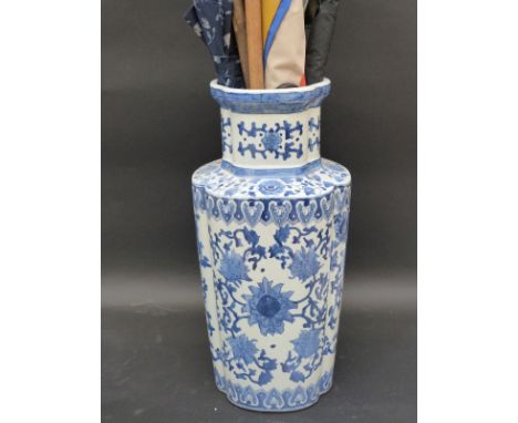 A Chinese blue and white floor vase, 50cm tall, together with various umbrellas, shooting stick, etc