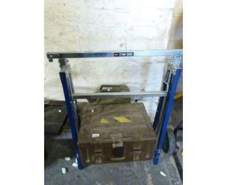 A box of tools, jerry can and a trestle