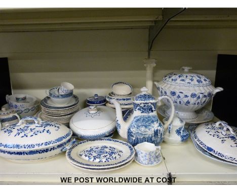 A large collection of blue and white ceramics including Spode and a large creamware candlestick