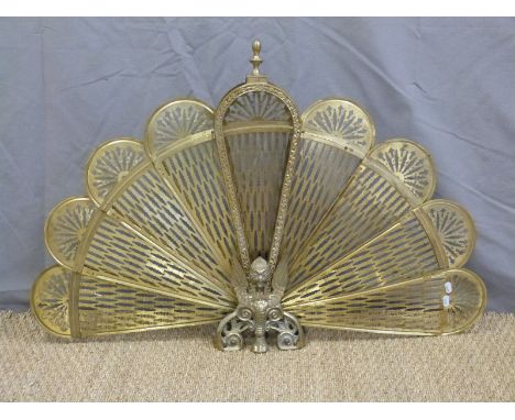 A brass fan firescreen and one other