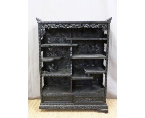 A Japanese heavily carved black lacquer bookcase/shelf unit with two drawers to base (H98 x W72 x D28cm)