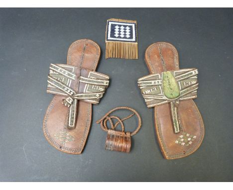 A pair of tribal leather and woven sandals, bracelet and a comb
