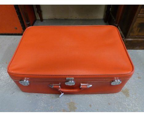 A vintage Emelia Earheart red suitcase, 68cm wide